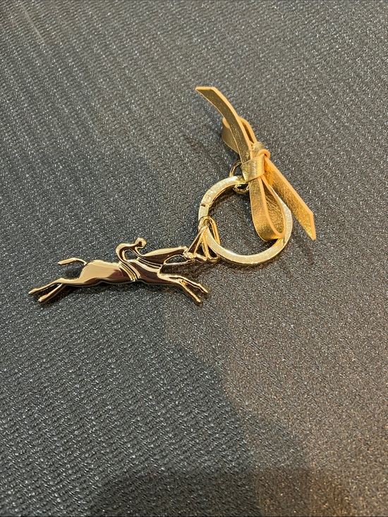 Longchamp Accessories - Gold-tone Running Deer Keychain with Bow Accent